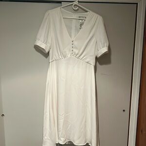 Slip on, short sleeve, comfy white dress. Snug feel. Must have for quick getaway